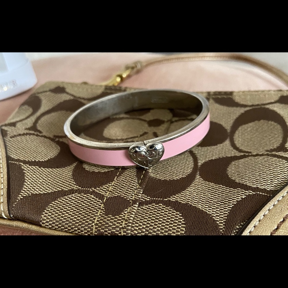 Light pink Coach enamel bangle with heart clasp